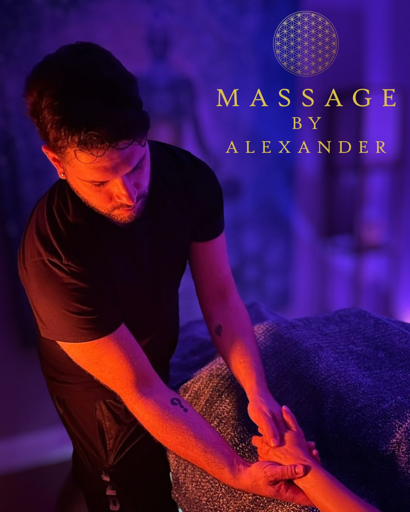 Alexander giving a massage in warm amber and violet light